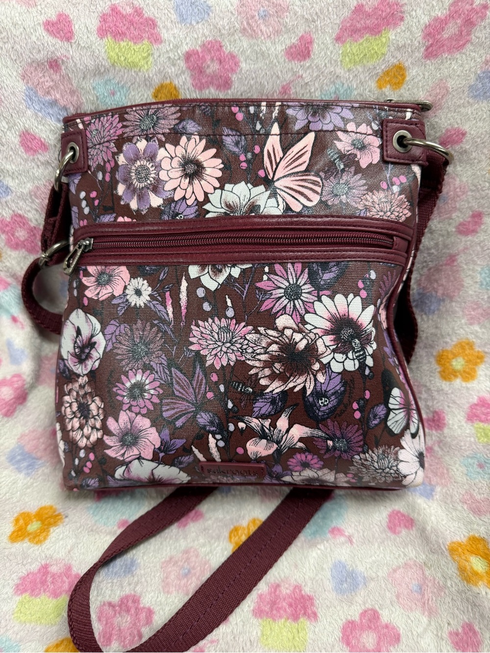 Sakroots Floral Crossbody Bag in Burgundy with Pink and Lavender Accents